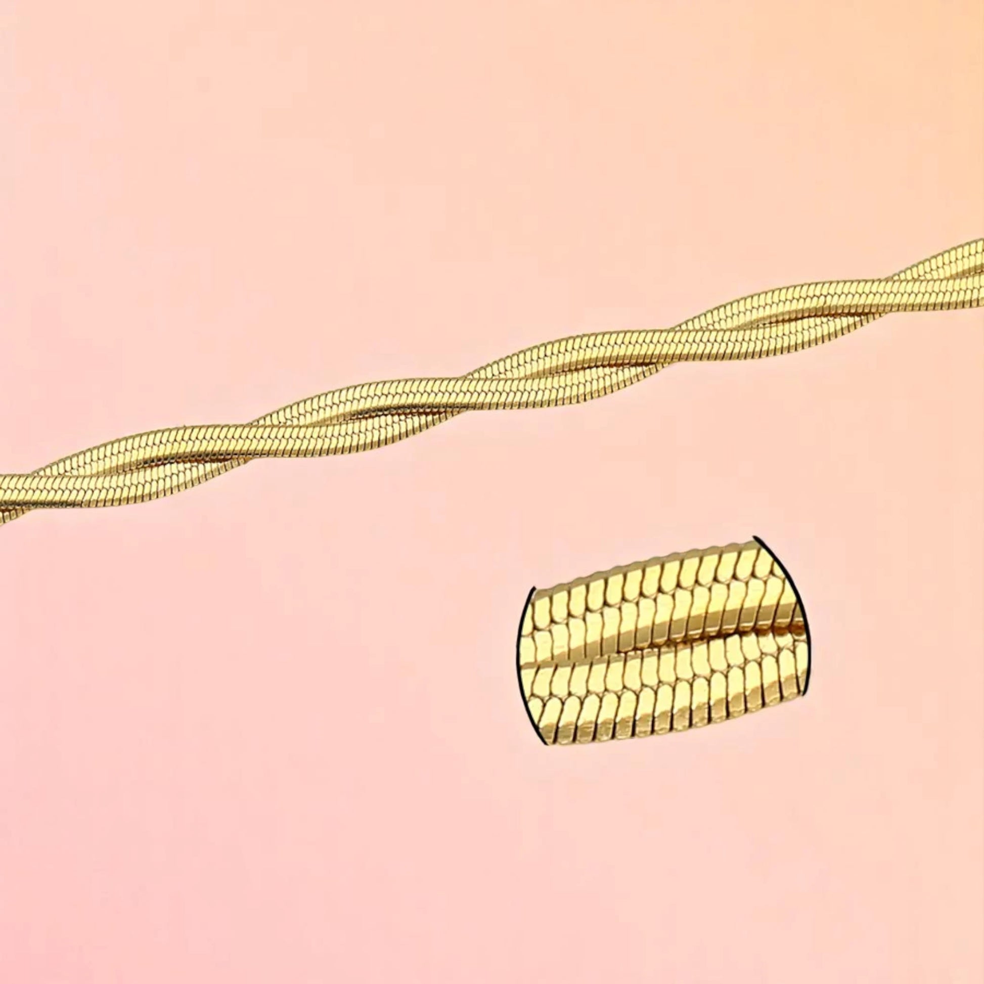 Bracelet zoom-in shot with close-up inset displayed on a light-toned background.