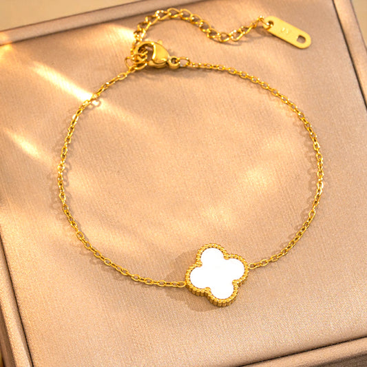 Bracelet on a soft fabric box with a light-toned background.