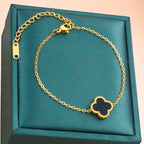 Bracelet on a soft fabric box with a light-toned background.