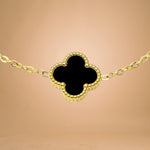 Bracelet zoom-in shot displayed on a peach-toned background.