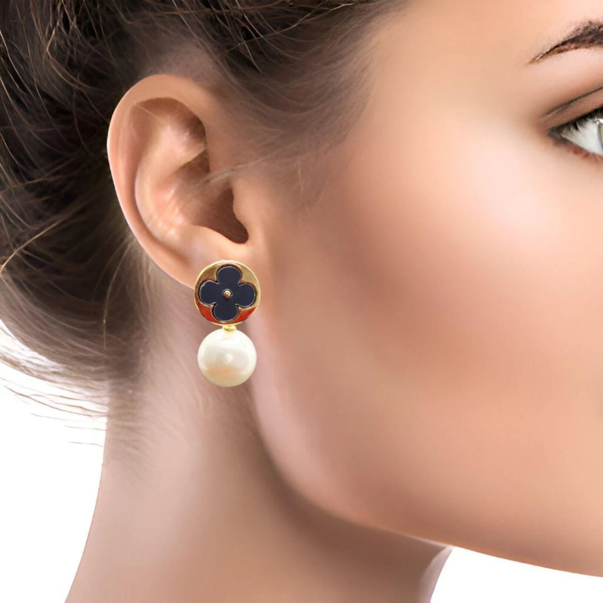 Black Clover Pearl Drop Earrings worn by a model.