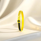 Bracelet set against a soft cream cloth background.