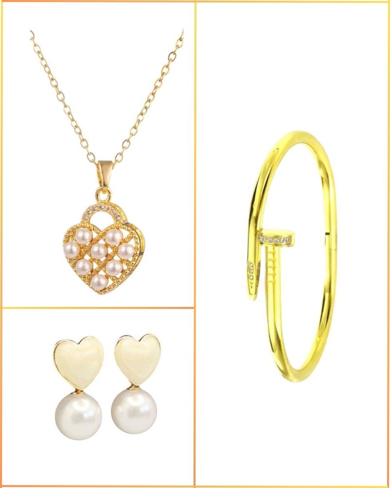 Gold necklace with heart-shaped pendant, gold bangle, and pearl earrings on a white background