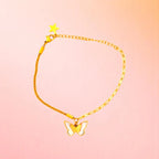 Bracelet on a color gradient of peach tones background.
