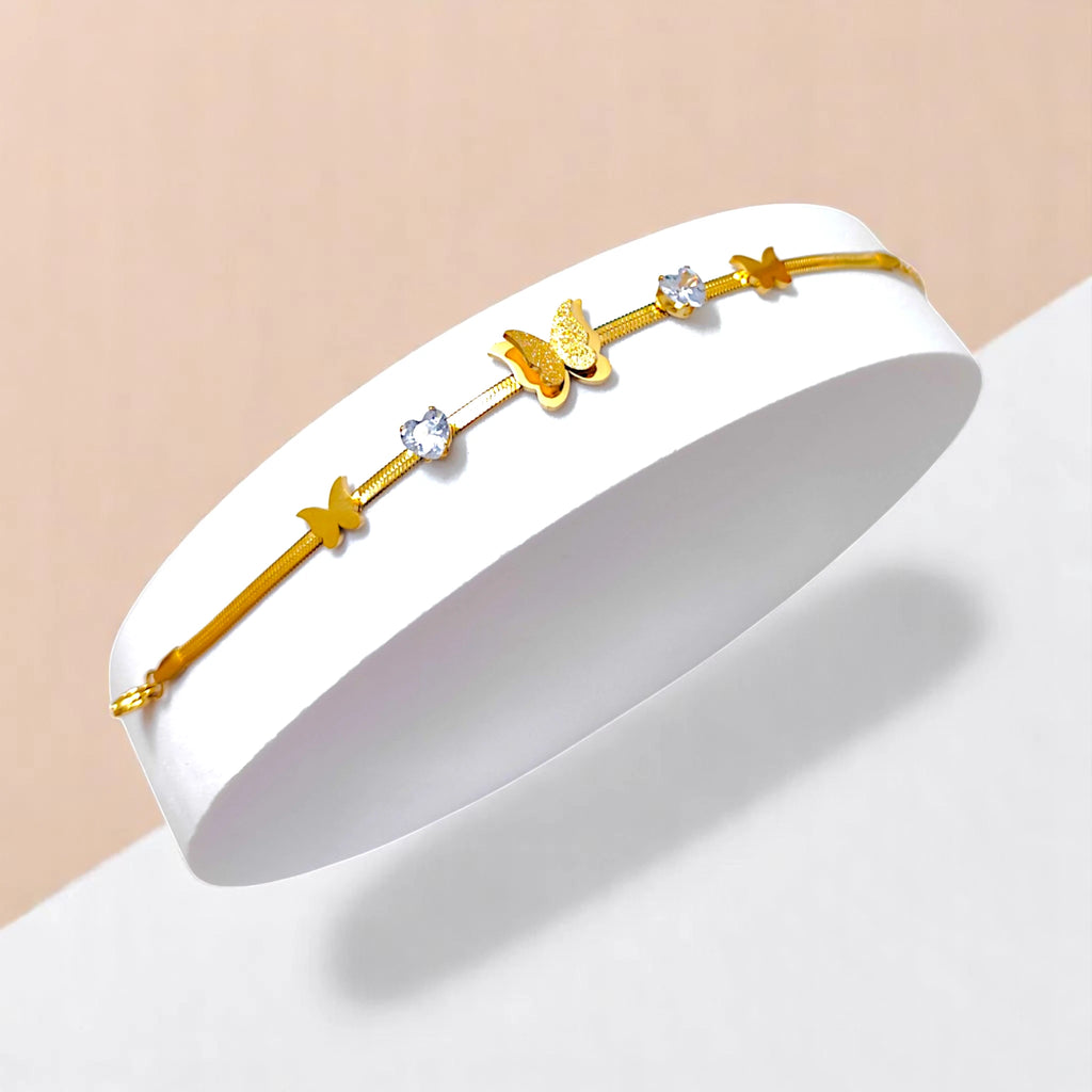 Bracelet on geometric prop with white and peach color gradient in the background.