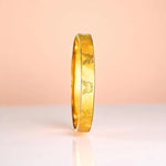 Bracelet set against a soft gradient background.