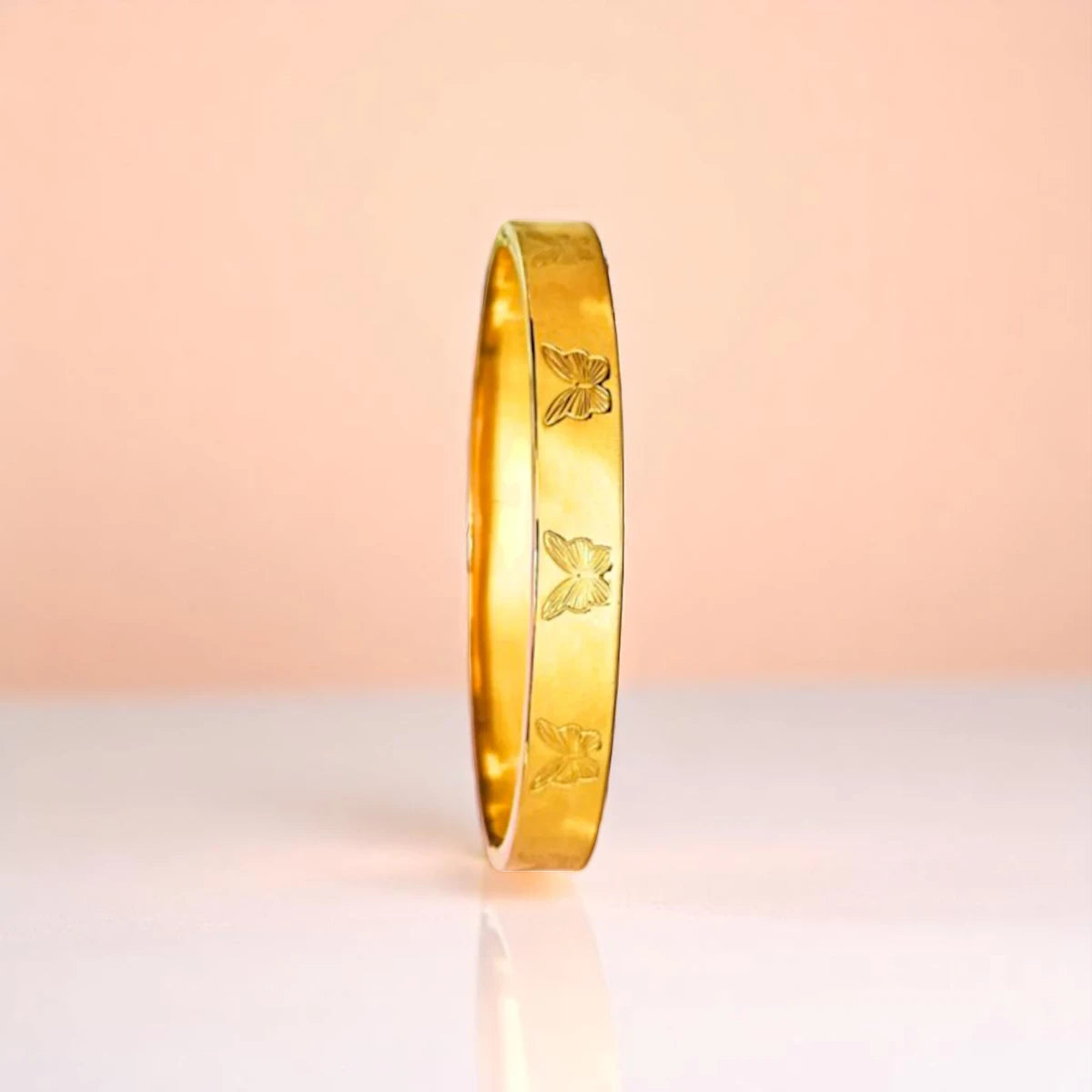 Bracelet set against a soft gradient background.