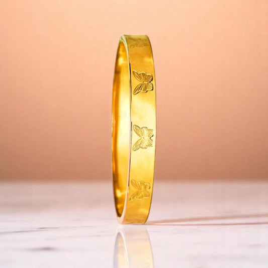 Bracelet on a color gradient of peach tones background.