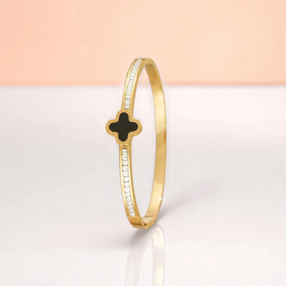 Bracelet set against a soft gradient background.