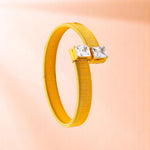 Bracelet on a color gradient of peach tones background.