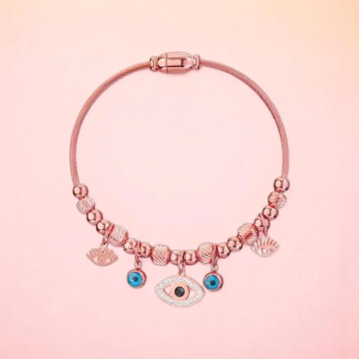 Bracelet on a color gradient of peach tones background.