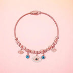 Bracelet on a color gradient of peach tones background.
