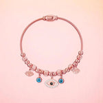 Bracelet on a color gradient of peach tones background.