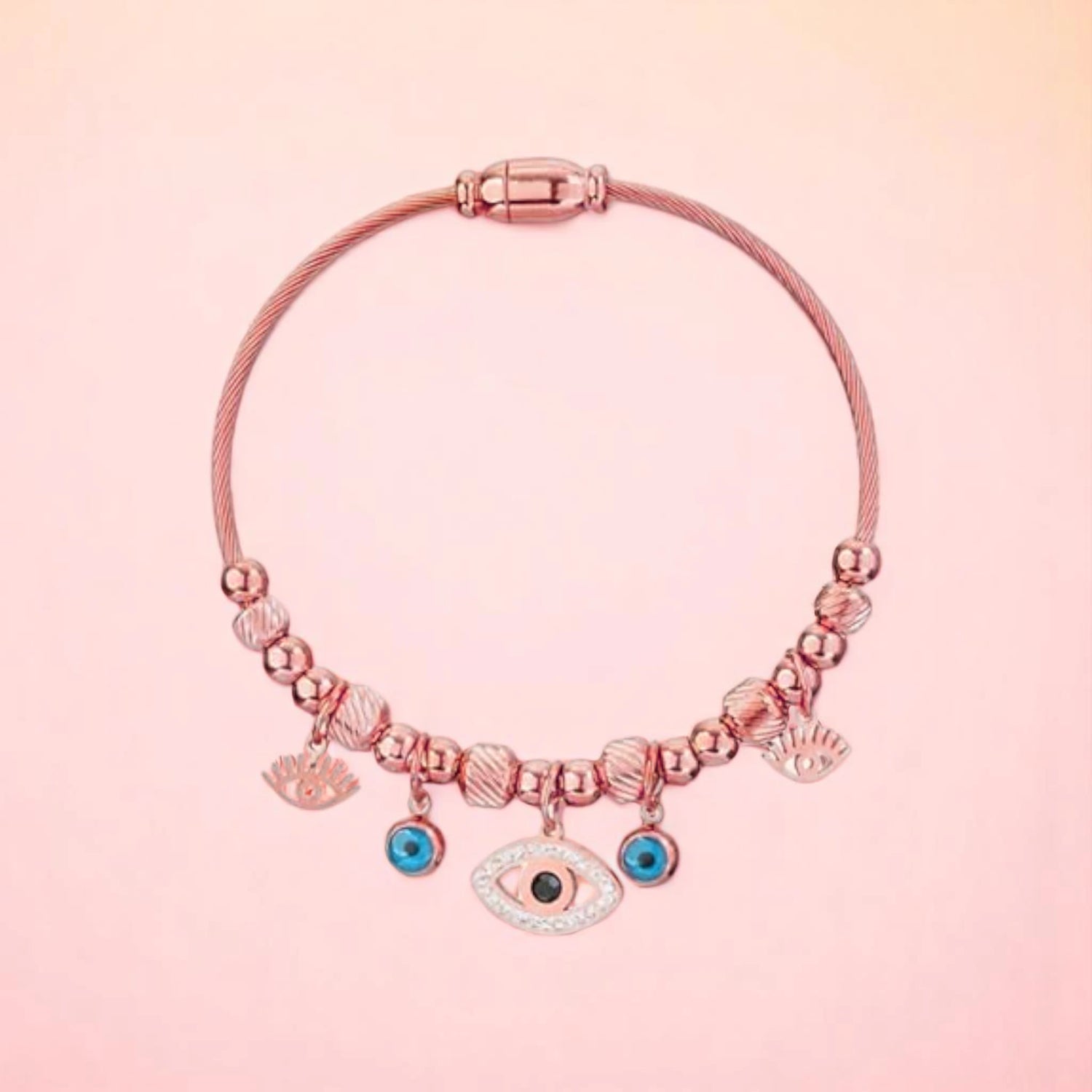 Bracelet on a color gradient of peach tones background.