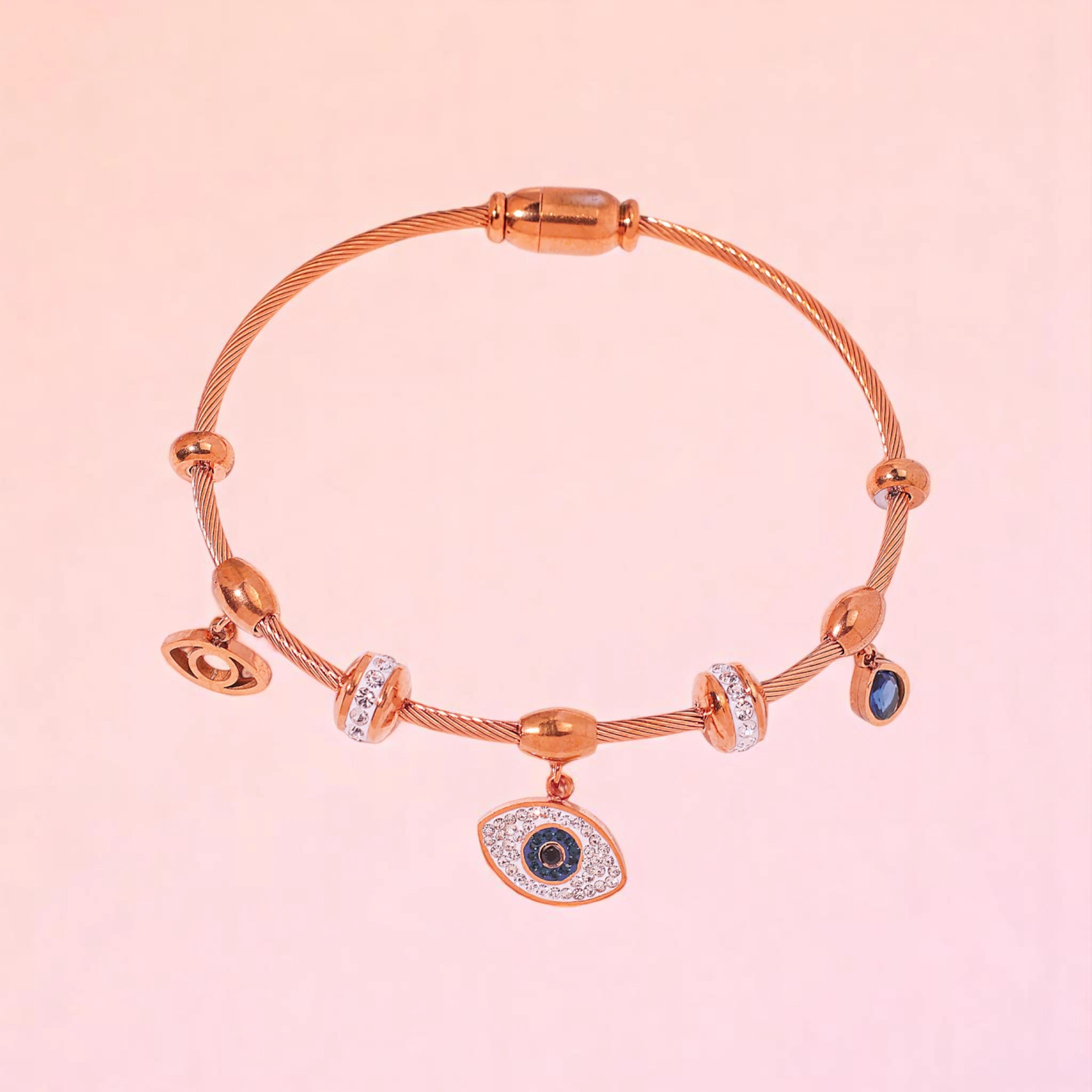 Bracelet on a color gradient of peach tones background.