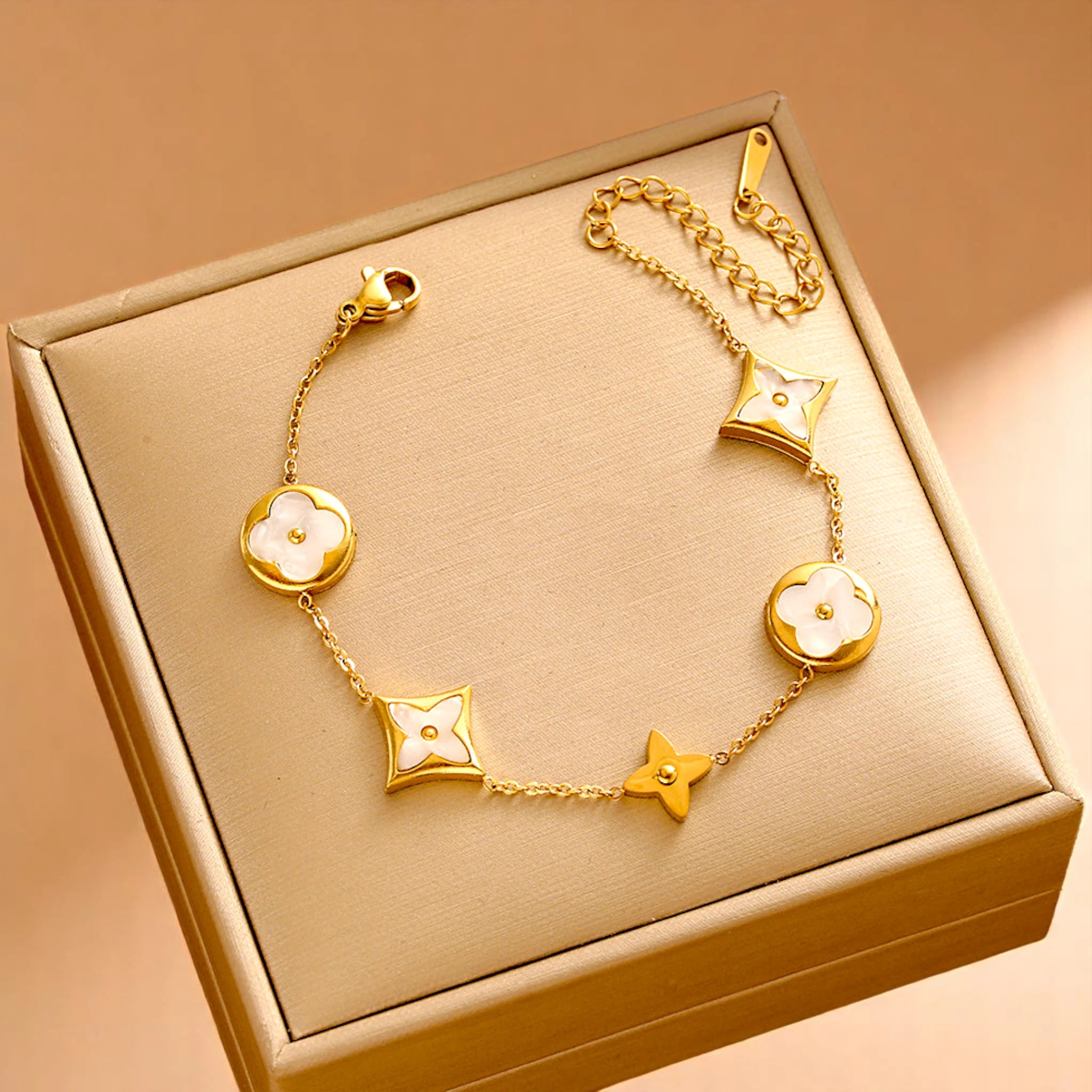 Bracelet on soft fabric box with a light toned background.