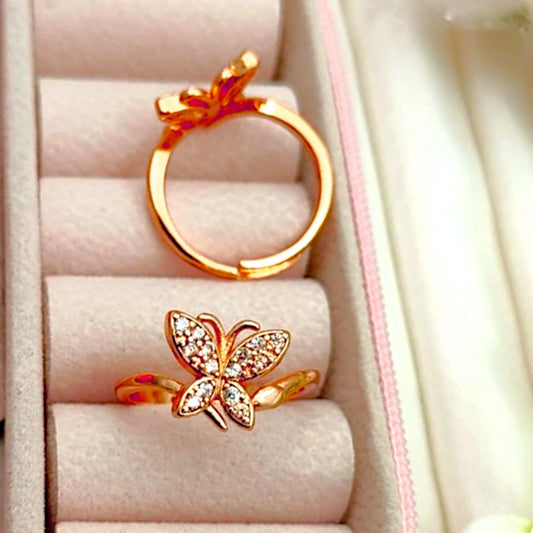 Two rings displayed in a velvet jewelry box