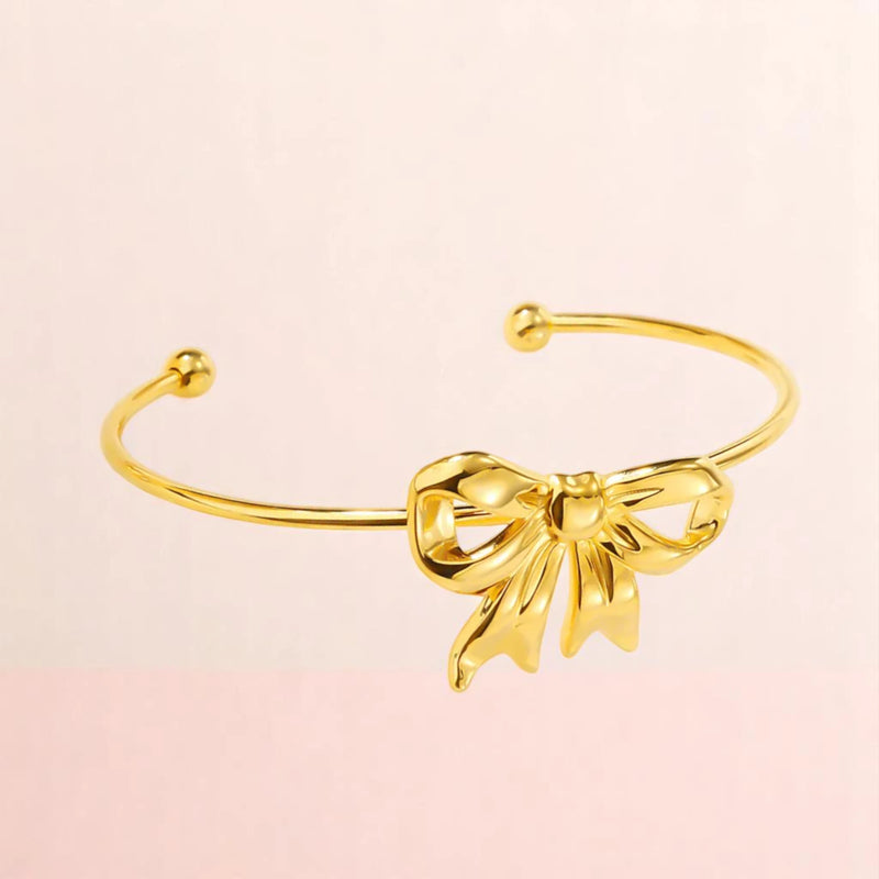 Bracelet on a color gradient of peach tones background.
