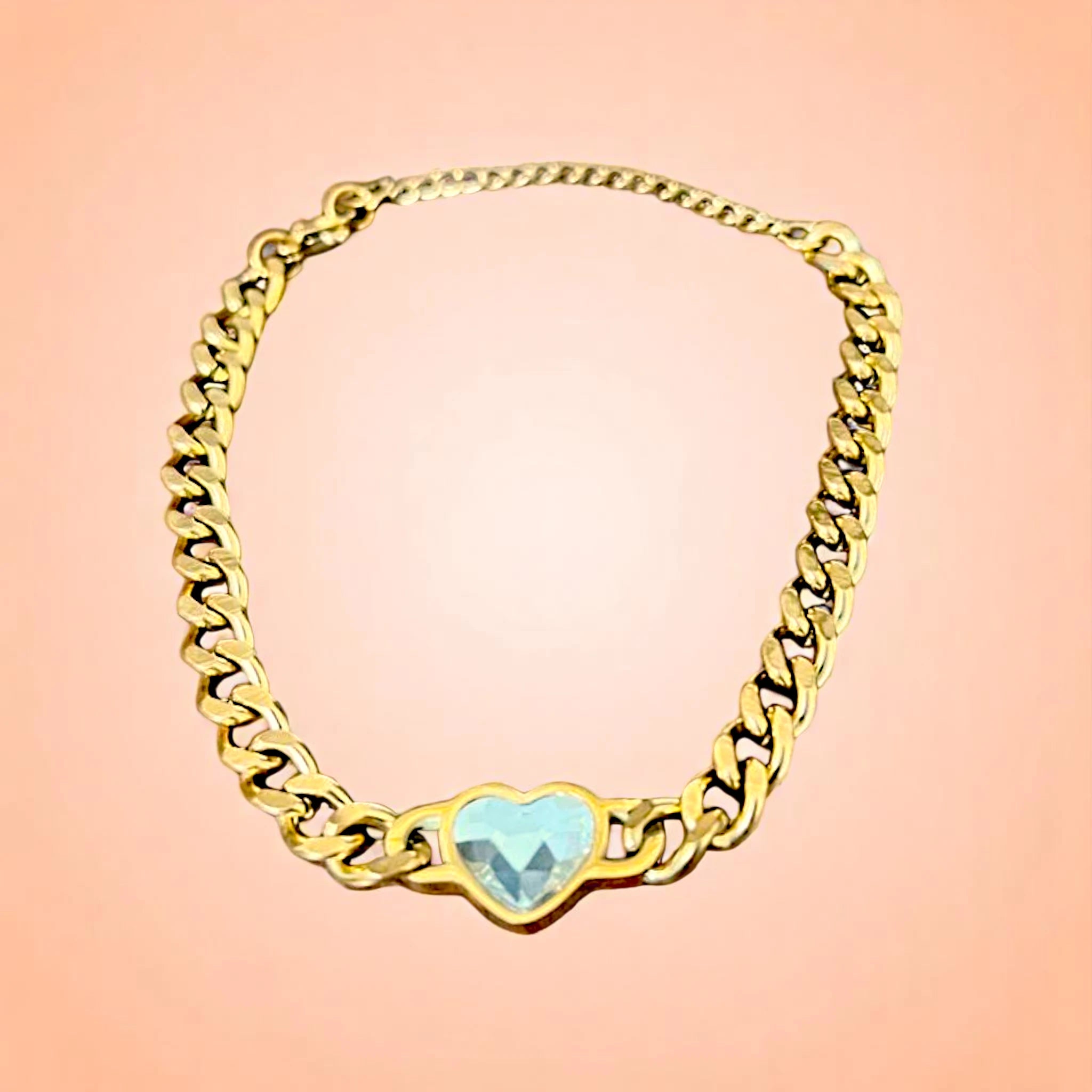 Bracelet on a color gradient of peach tones background.