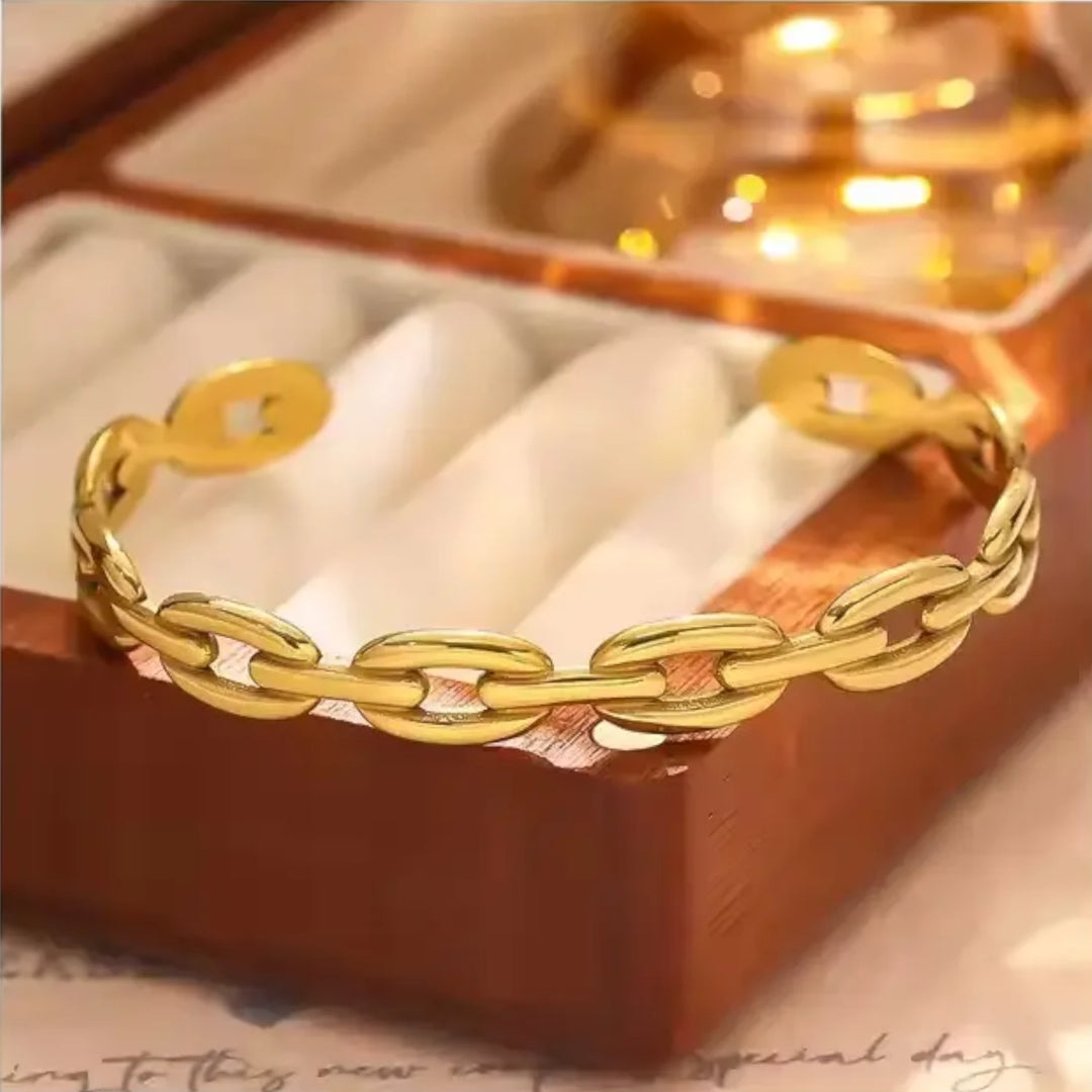Bracelet on soft fabric wooden box with a toned background.