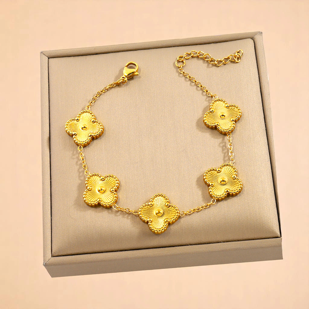 Bracelet on soft fabric box with a light toned background.