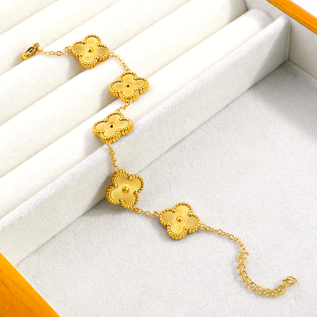 Bracelet on a soft fabric box with a light-toned background.