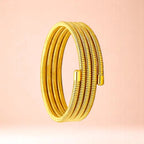 Bracelet on a color gradient of peach tones background.