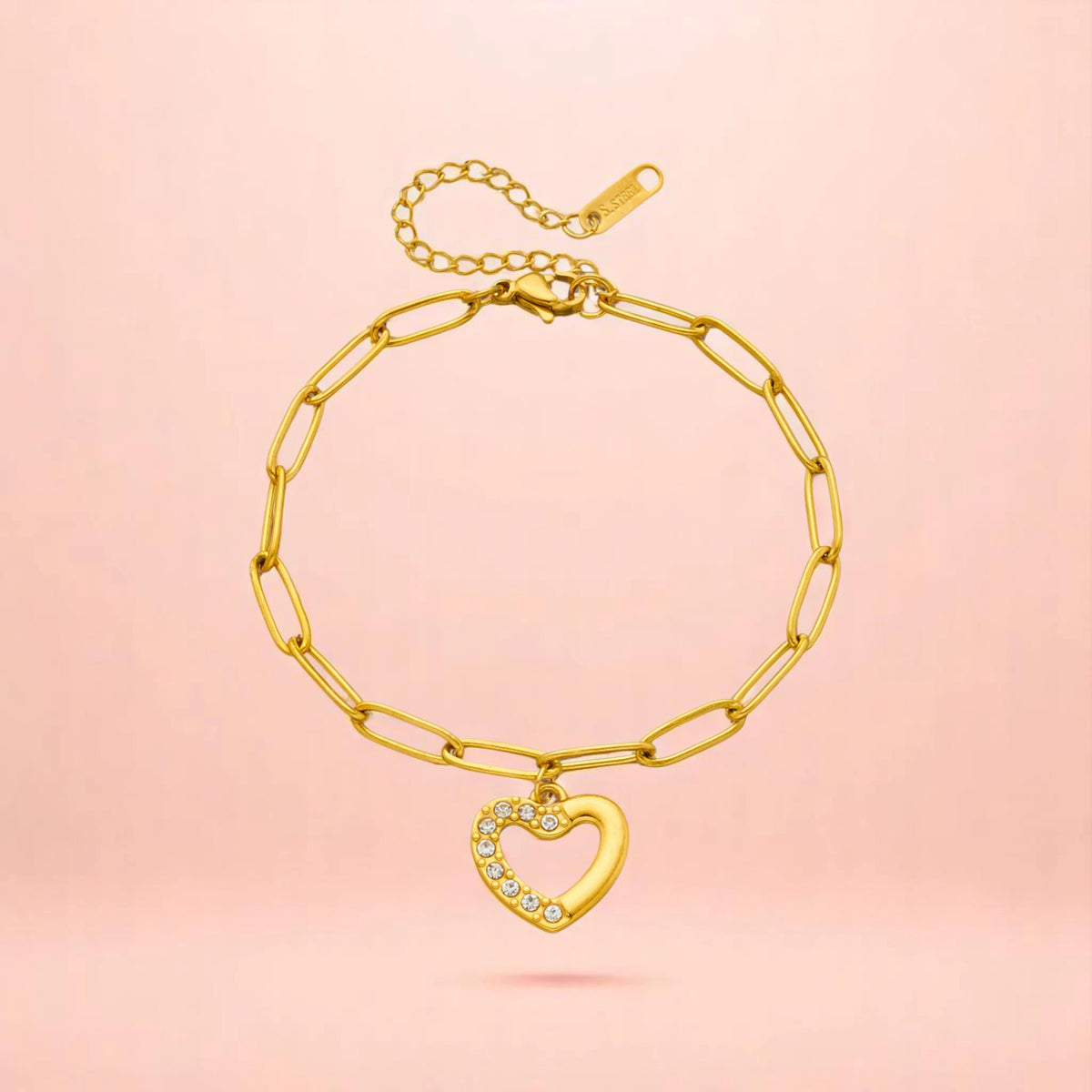 Bracelet on a color gradient of peach tones background.