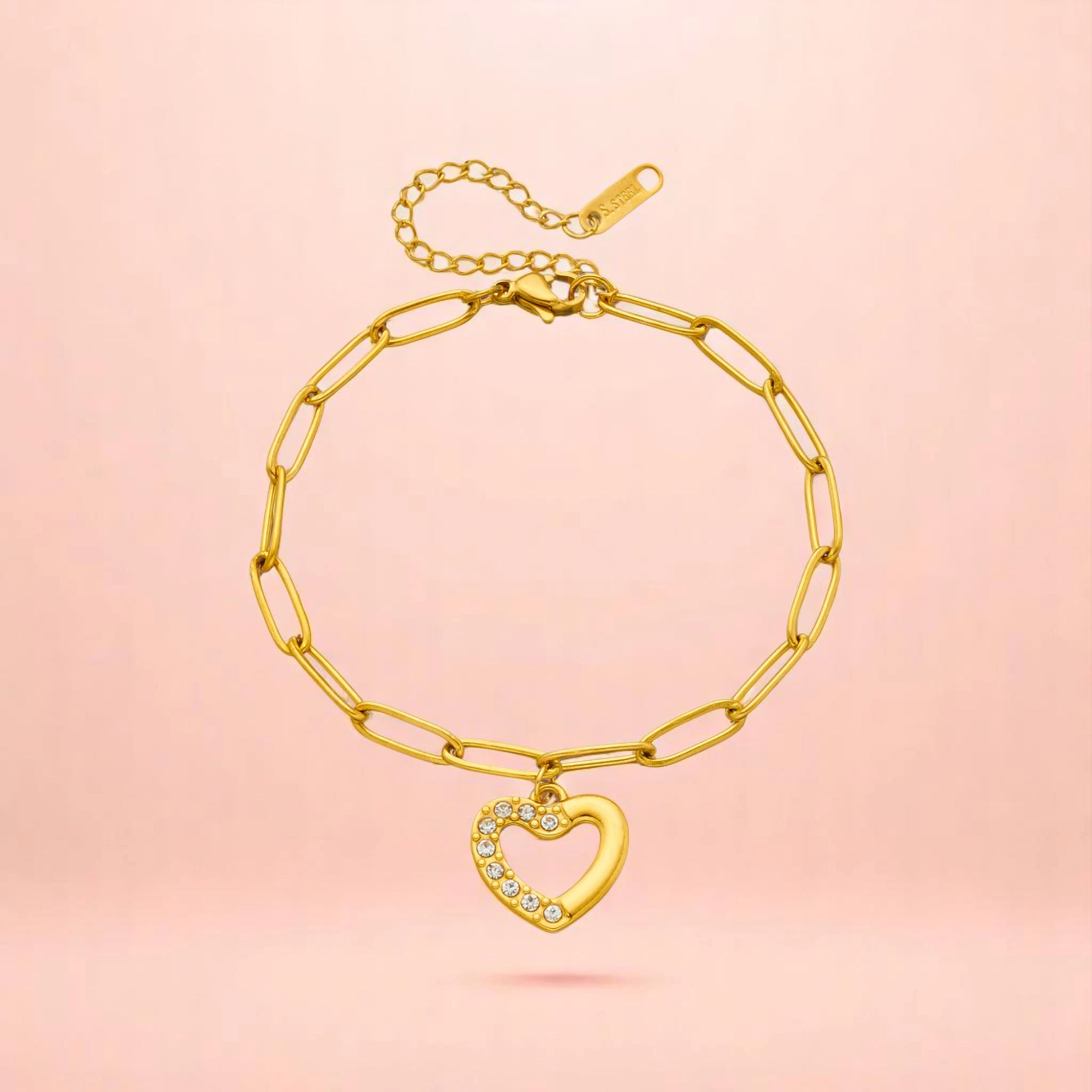 Bracelet on a color gradient of peach tones background.