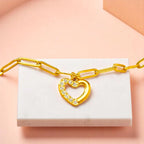 Bracelet on geometric prop with peach color gradient in the background.