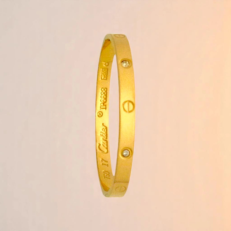 Bracelet on a color gradient of peach tones background.