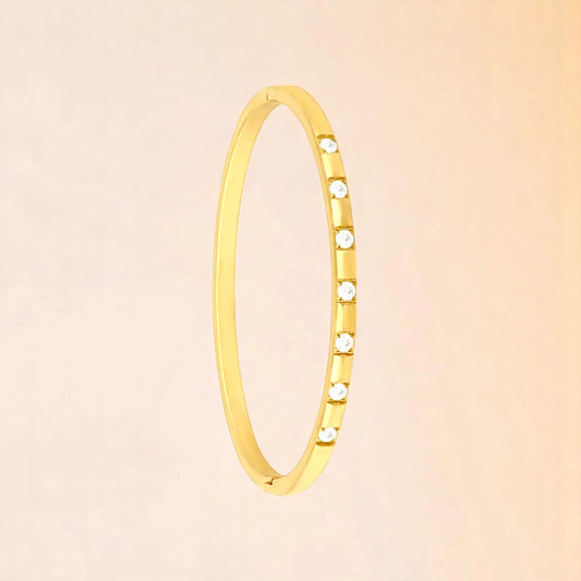 Bracelet on a color gradient of peach tones background.
