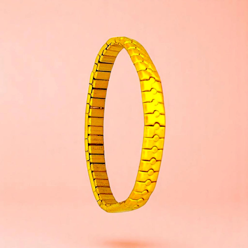 Bracelet on a color gradient of peach tones background.