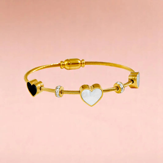 Bracelet on a color gradient of peach tones background.