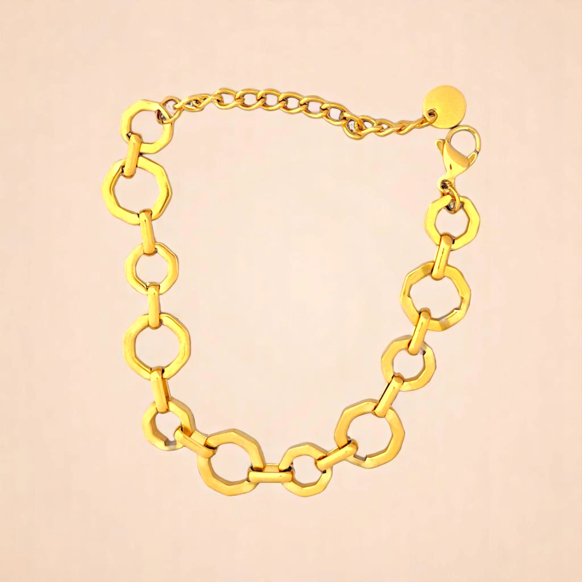 Bracelet on a color gradient of peach tones background.