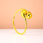 Bracelet on a color gradient of peach tones background.