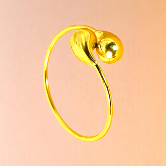 Bracelet on a color gradient of peach tones background.