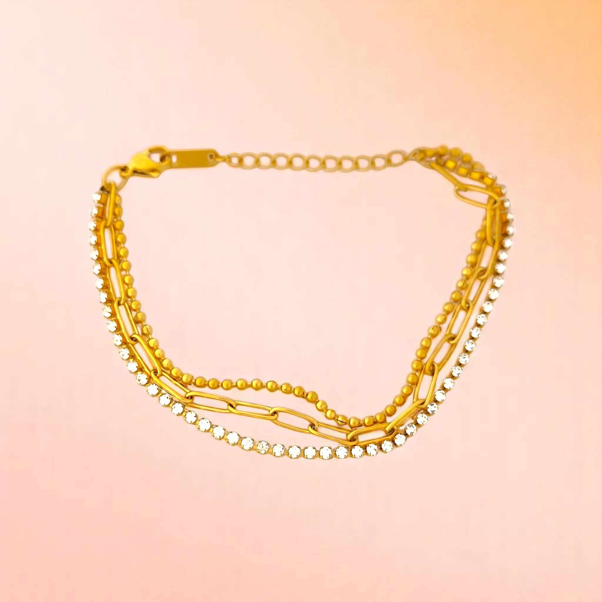 Bracelet on a color gradient of peach tones background.