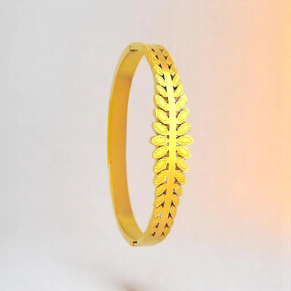 Bracelet on a color gradient of peach tones background.