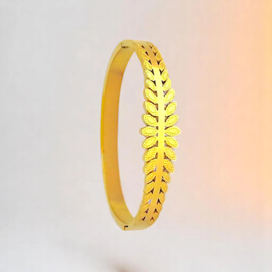 Bracelet on a color gradient of peach tones background.