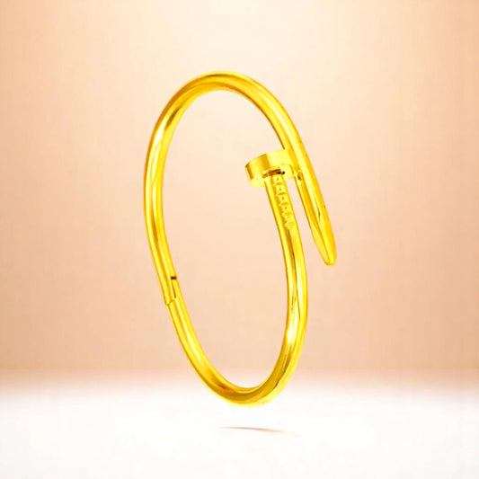 Bracelet on a color gradient of peach tones background.