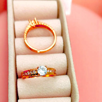 Two rings displayed in a velvet jewelry box.