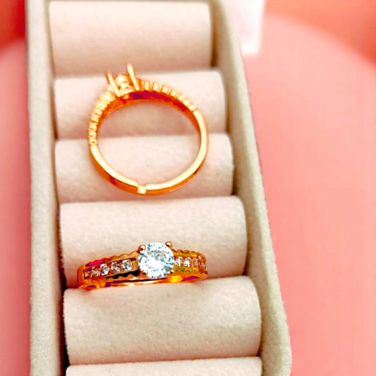 Two rings displayed in a velvet jewelry box.