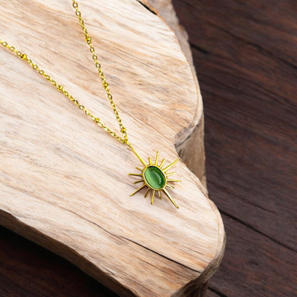 Gold Sunburst Necklace with Elegant Green Stone Pendant