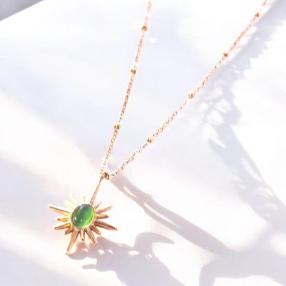 Gold Sunburst Necklace with Elegant Green Stone Pendant