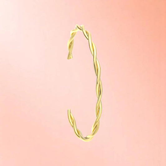 Bracelet on a color gradient of peach tones background.