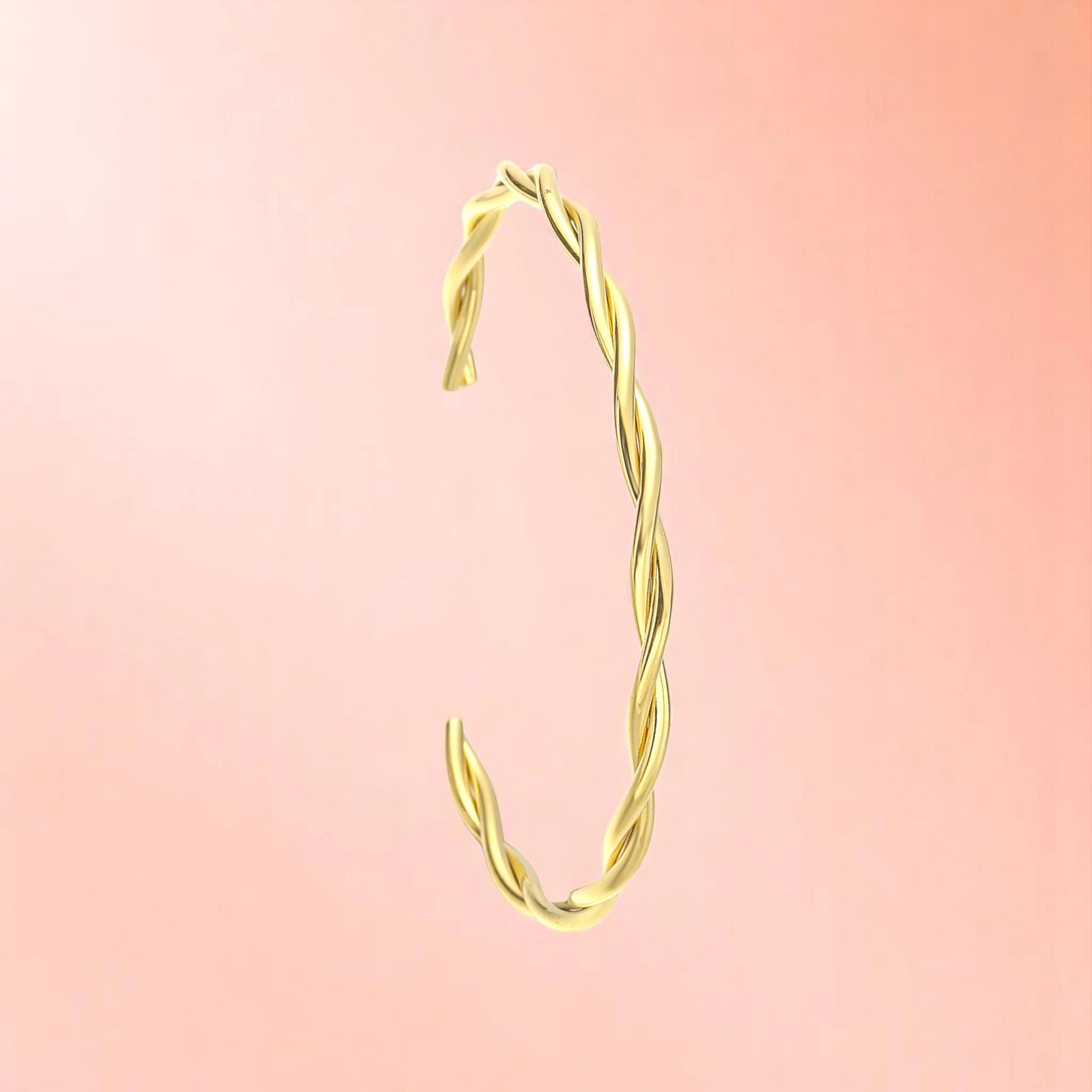 Bracelet on a color gradient of peach tones background.