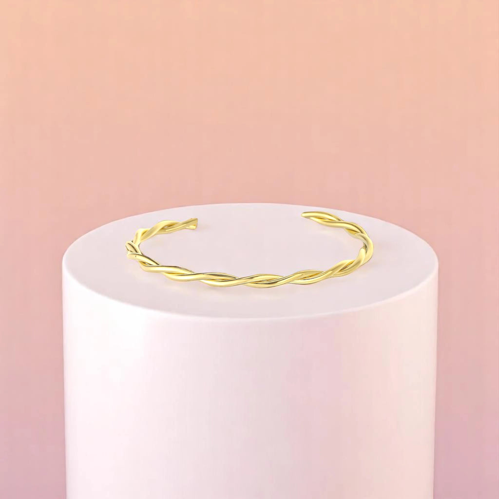 Bracelet on geometric prop with peach color gradient in the background.