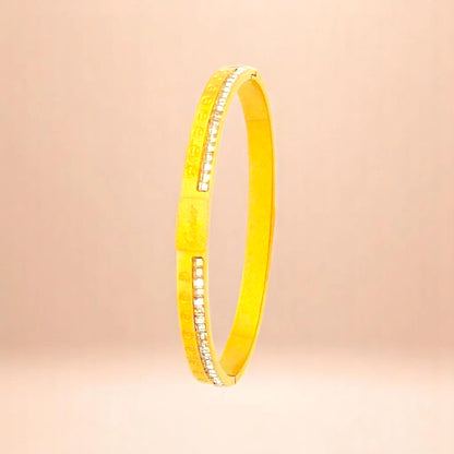 Bracelet on a color gradient of peach tones background.