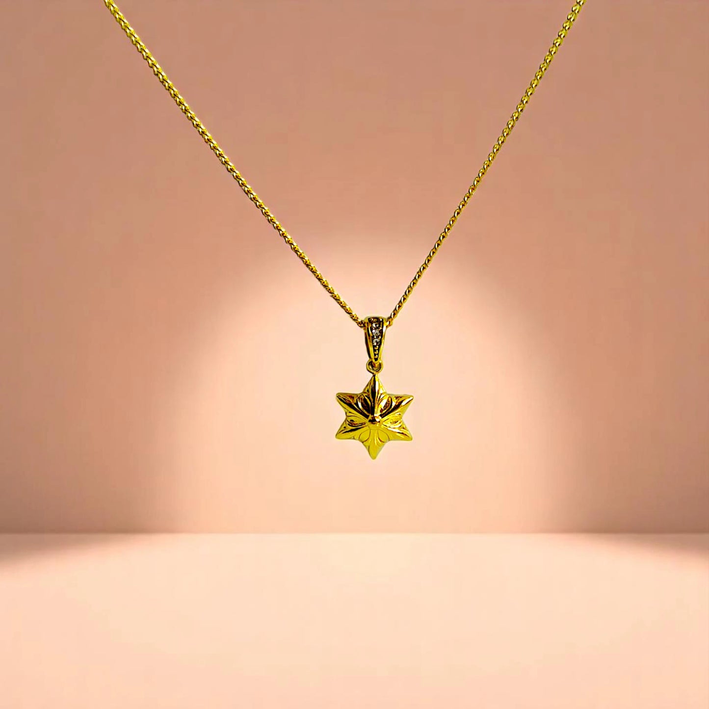 Necklace on a peach-toned gradient background.